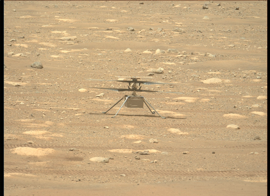 A wide view of the small 19 inch Ingenuity helicopter taken by Perseverance